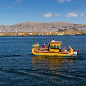 yellow and brown boat on sea during daytime